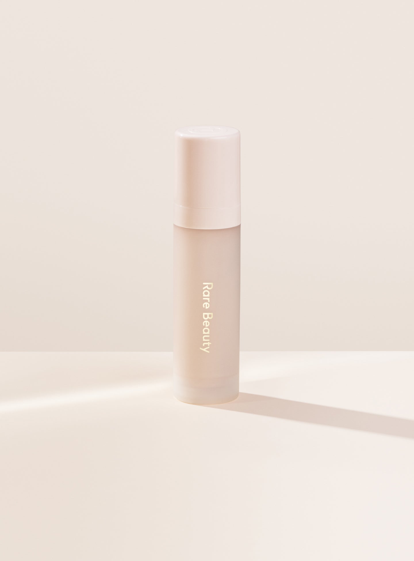 | Rare Beauty's Illuminating Primer Mini, designed to smooth, hydrate, and illuminate skin, prepping for makeup that lasts all day.